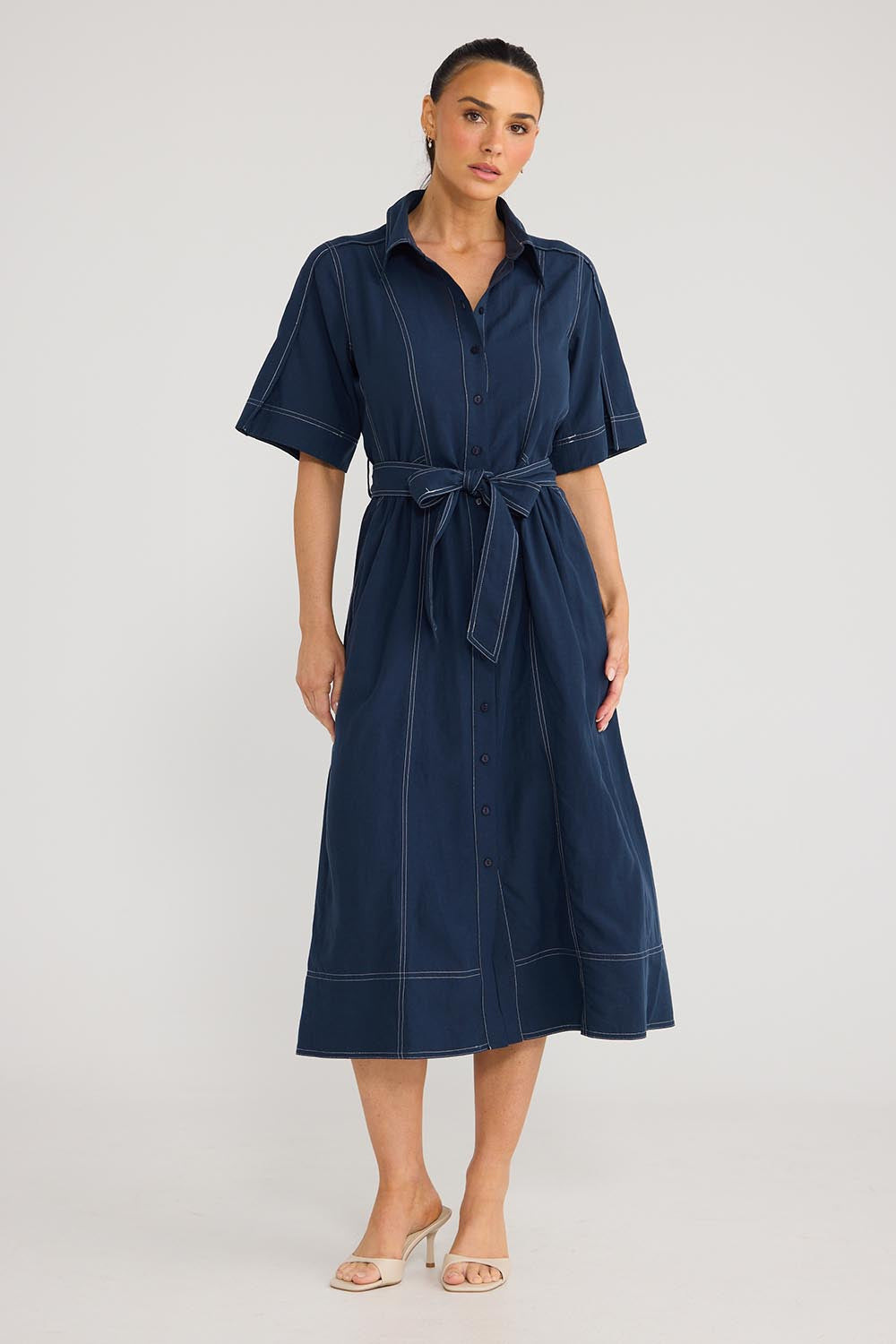 Model Genericm wearing size sample of the Leo Dress - Navy in colour Navy, from the front