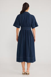 Model Genericm wearing size sample of the Leo Dress - Navy in colour Navy, from the front