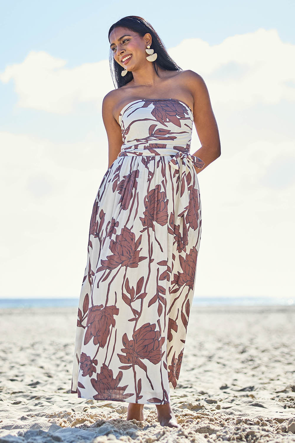 Model Eshan wearing size 10 of the Avalon Dress - Siennavine in colour Siennavine, from the front