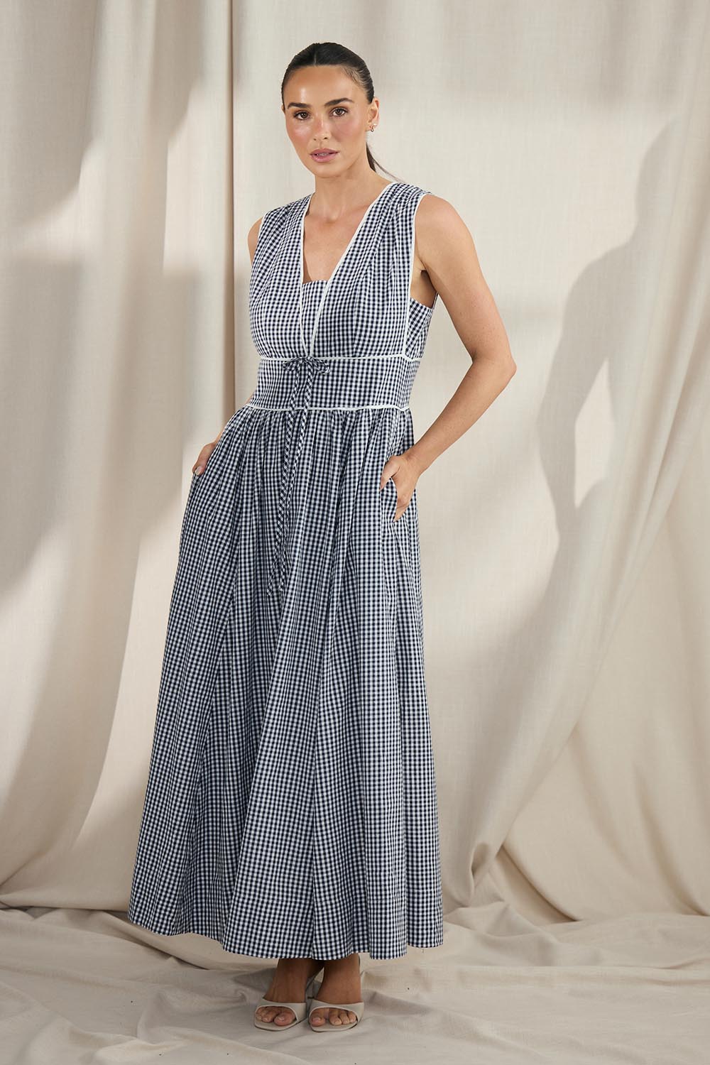 Model Genericm wearing size sample of the Pimms Dress - Navycheck in colour Navycheck, from the front