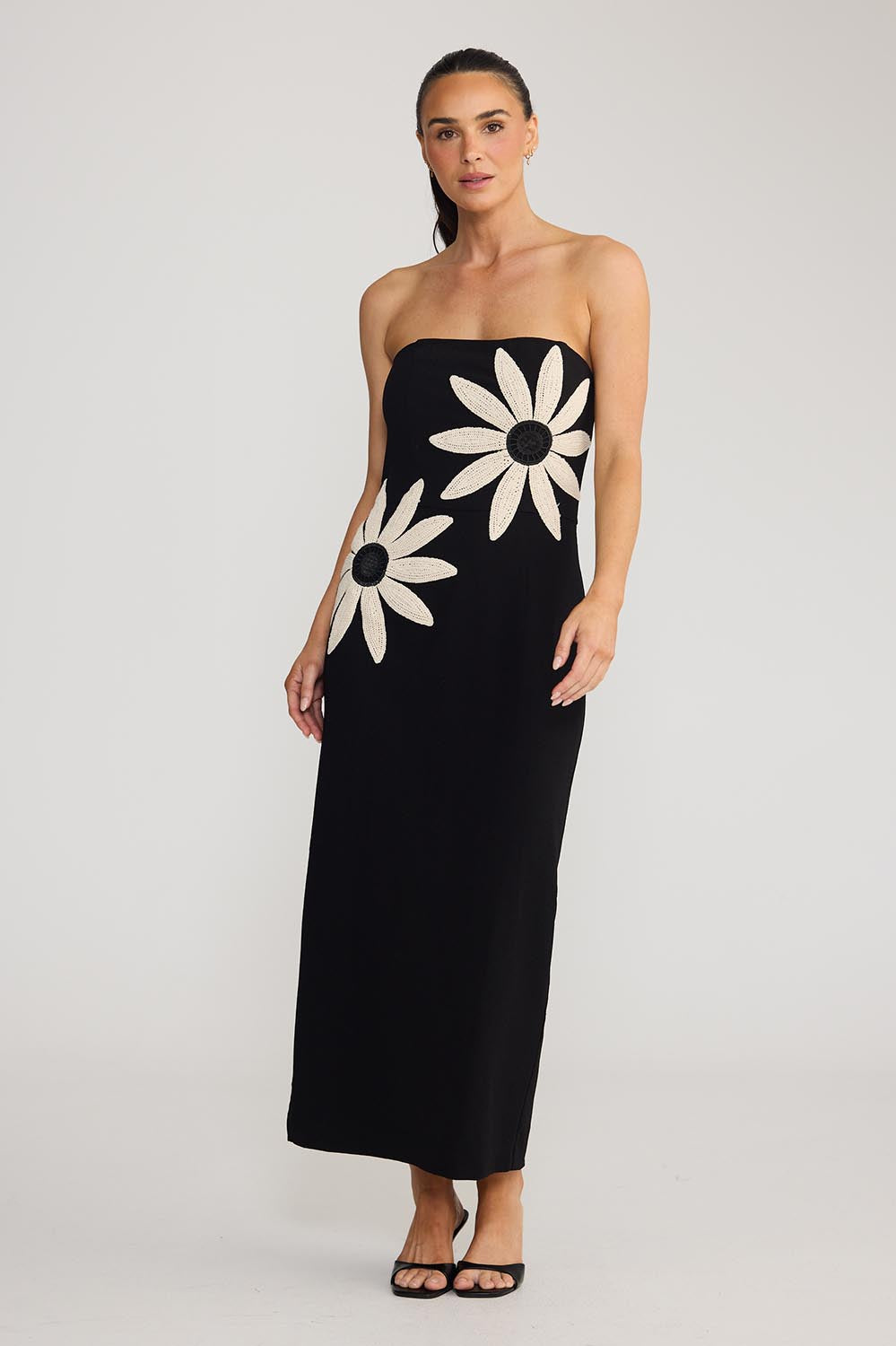 Model Genericm wearing size sample of the Jacqueline Dress - Black in colour Black, from the front