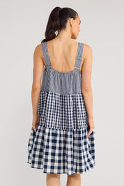 Model Genericm wearing size sample of the Clarice Dress - Navycheck in colour Navycheck, from the back