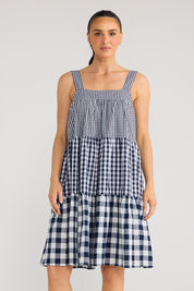 Model Genericm wearing size sample of the Clarice Dress - Navycheck in colour Navycheck, in a cropped view