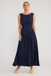 Model Genericm wearing size sample of the Tamara Dress - Inknavy in colour Inknavy, from the front