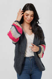 A model wearing the Cassidy Knit in colour Navy (Blue), from the front, cropped image