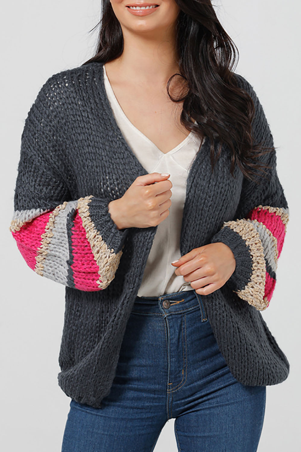 A model wearing the Cassidy Knit in colour Navy (Blue), from the front, cropped image