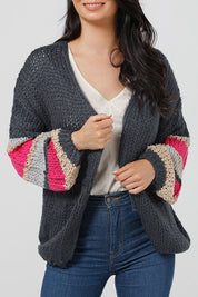 A model wearing the Cassidy Knit in colour Navy (Blue), from the front, cropped image