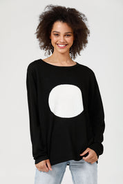 A model wearing the Petra Spot Knit in colour Blkwhite (Black), from the front, cropped image