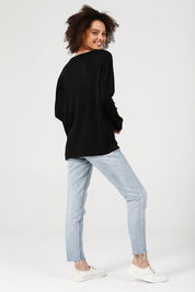 A model wearing the Petra Spot Knit in colour Blkwhite (Black), from the front, showing the whole outfit