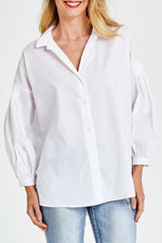Model Kelly wearing size S of The Duchess Shirt in colour White (White), from the front, cropped image