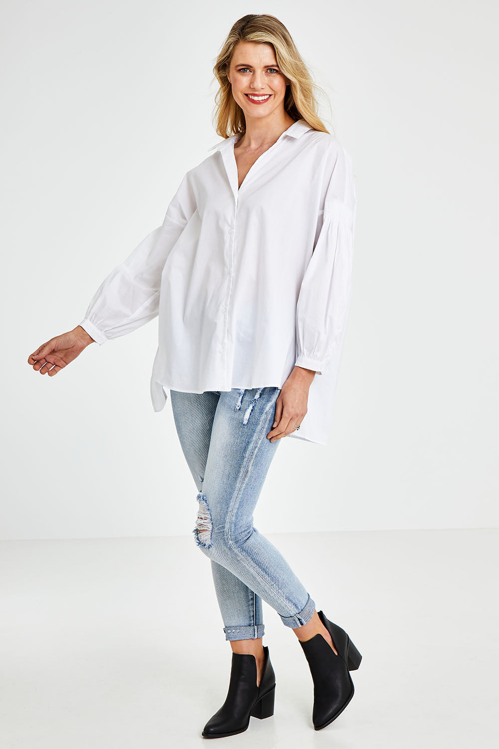 Model Kelly wearing size S of The Duchess Shirt in colour White (White), from the front, showing the whole outfit