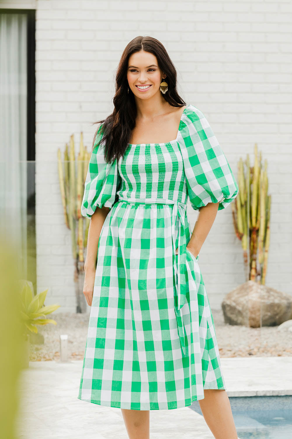 Model Stacey wearing size S of the Bellini Sundress in colour Applecheck (Green), from the front, showing the whole outfit