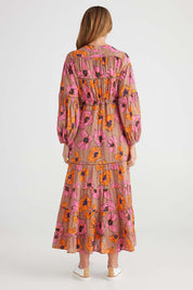 A model wearing the Gertie Dress in colour Bromley, from the back