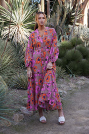 A model wearing the Gertie Dress in colour Bromley, from the front, showing the whole outfit