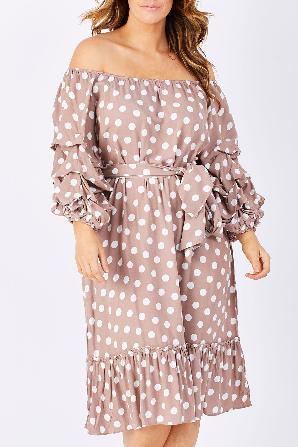 Model Laura wearing size M-L of the Saloon Dress in colour BlushDot (Pink), from the front, cropped image