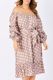 Model Laura wearing size M-L of the Saloon Dress in colour BlushDot (Pink), from the front, cropped image