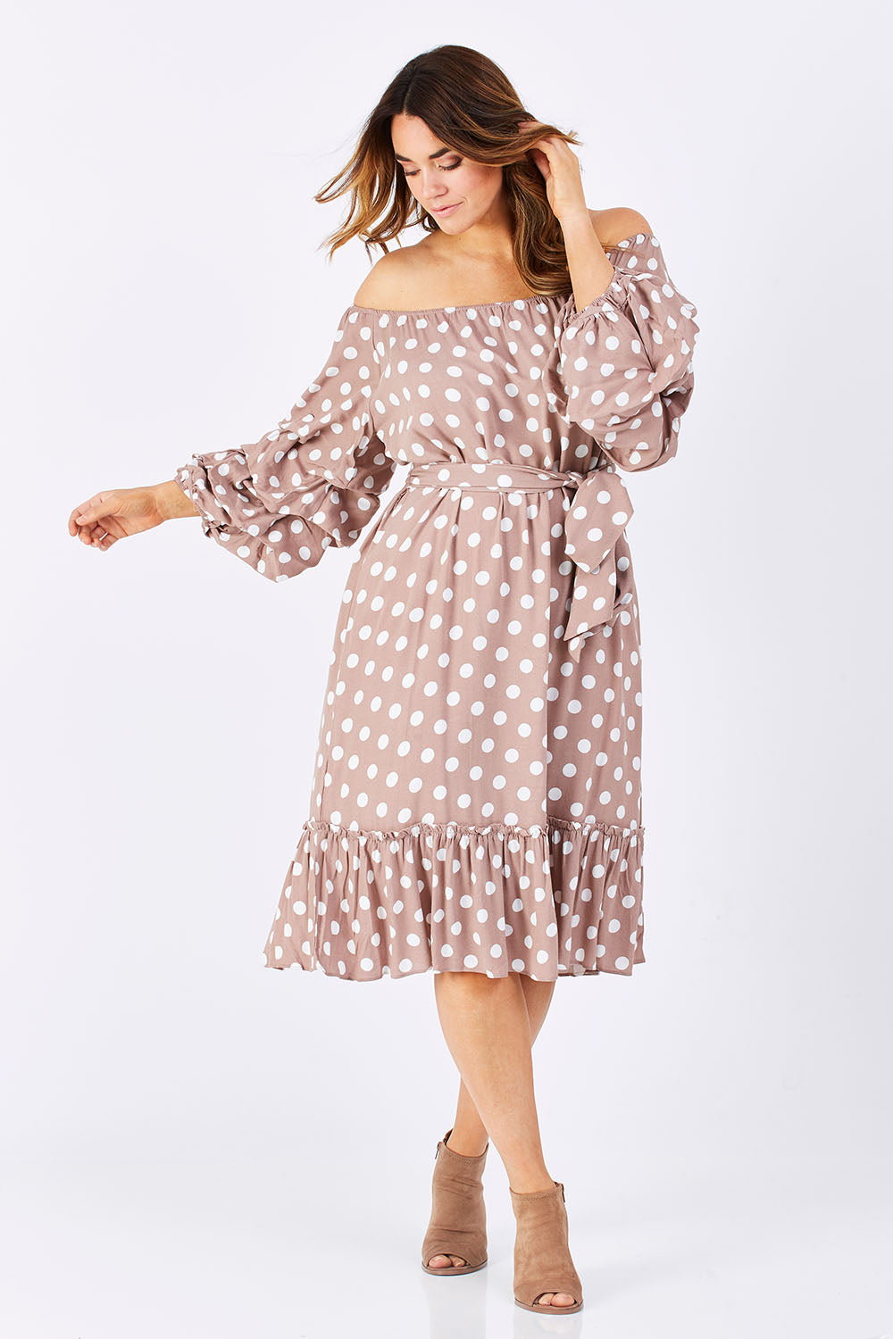 Model Laura wearing size M-L of the Saloon Dress in colour BlushDot (Pink), from the front, showing the whole outfit