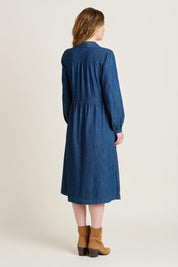 A model wearing the Ashmore Denim Dress in colour Denim (Blue), from the back