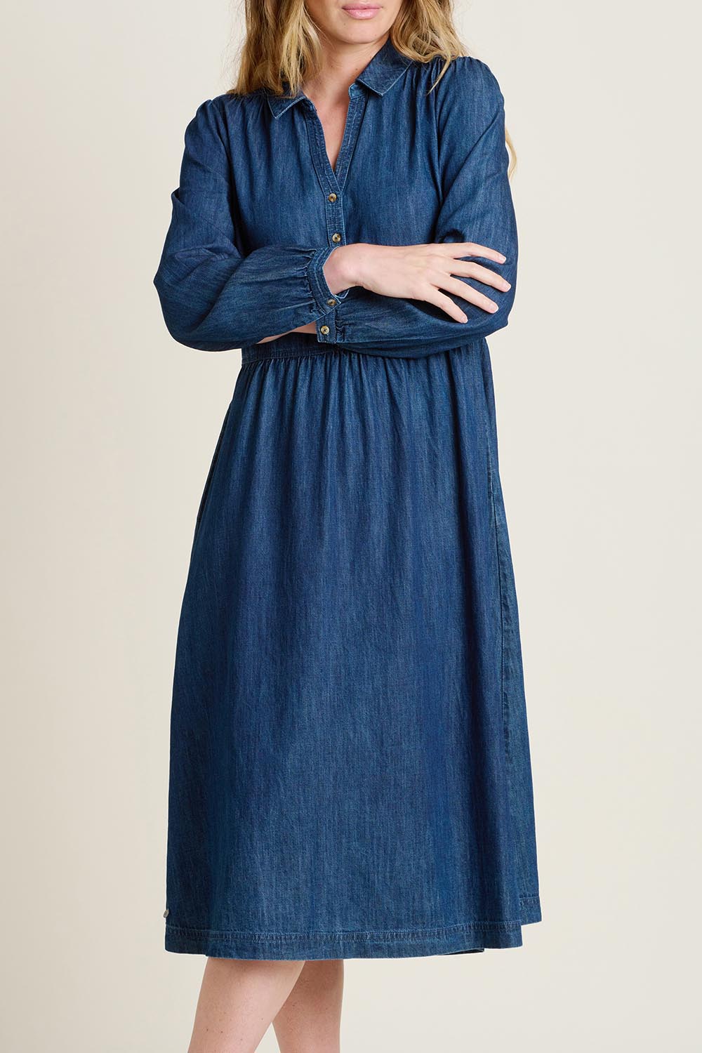 A model wearing the Ashmore Denim Dress in colour Denim (Blue), from the front, cropped image