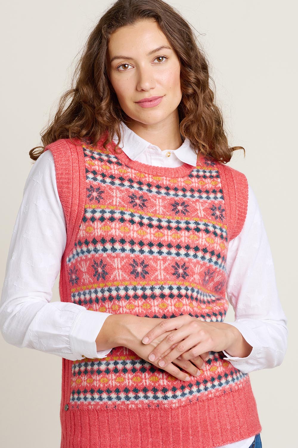 A model wearing the Pink Fairisle Knitted Vest in colour Red (Red), from the front, cropped image