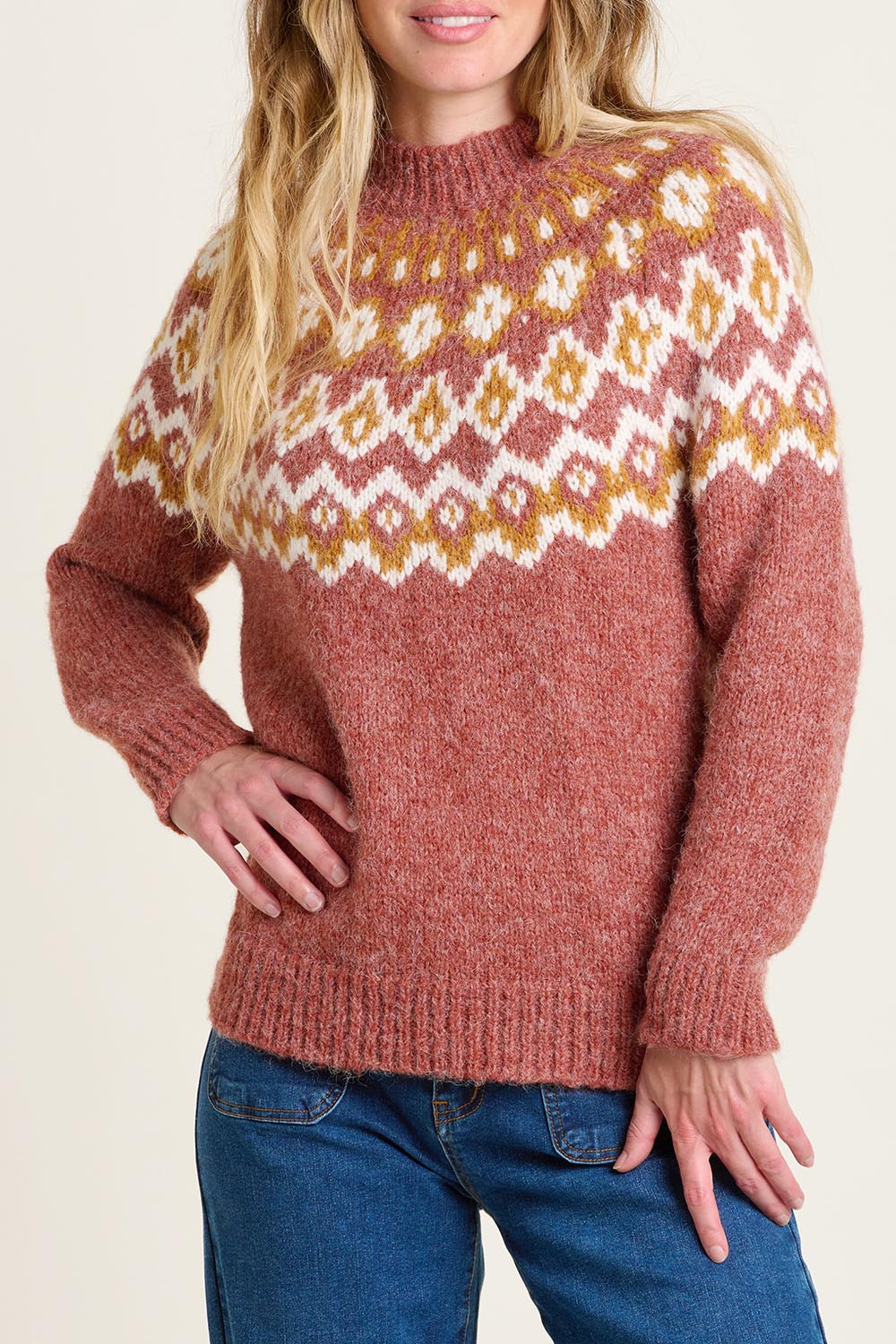 A model wearing the Chunky Knitted Fair Isle Jumper in colour Rust, from the front, cropped image