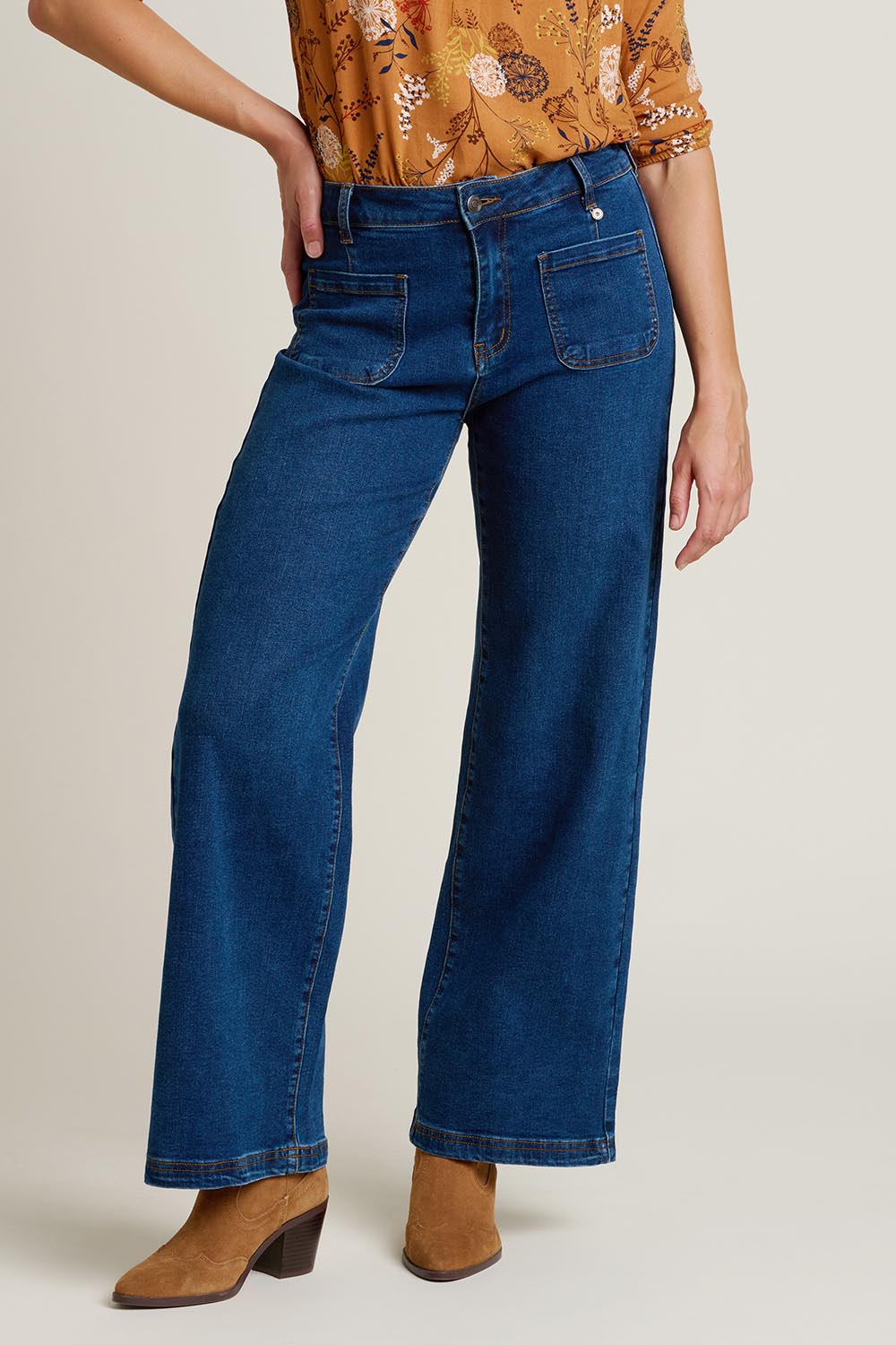 A model wearing the Wide Straight Leg Jeans in colour Denim (Blue), from the front, cropped image