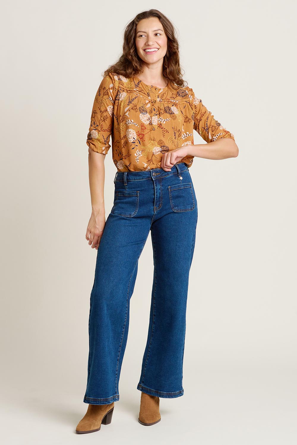 A model wearing the Wide Straight Leg Jeans in colour Denim (Blue), from the front, showing the whole outfit