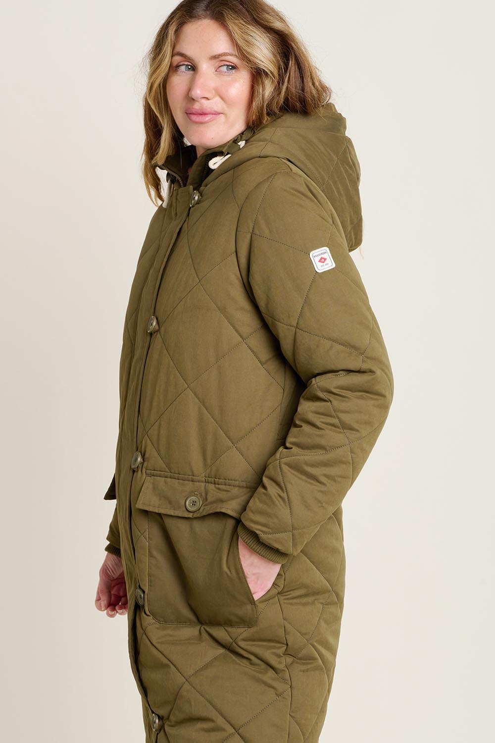 A model wearing the Bradstock Hooded Parka Jacket in colour Khaki (Green), from the front, cropped image