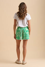 A model wearing the Wildflower Cotton Short in colour Green (Green), from the back