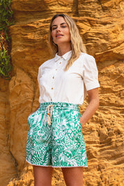 A model wearing the Wildflower Cotton Short in colour Green (Green), from the front, showing the whole outfit
