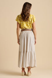 A model wearing the Stripe Cotton Blend Paper Bag Skirt in colour Natural, from the back
