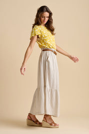 A model wearing the Stripe Cotton Blend Paper Bag Skirt in colour Natural, from the front, showing the whole outfit