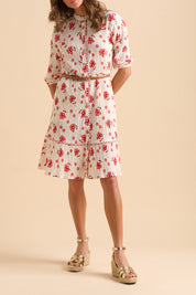 A model wearing the Fan Floral Cotton Knee Length Dress in colour Whitered, from the front, cropped image