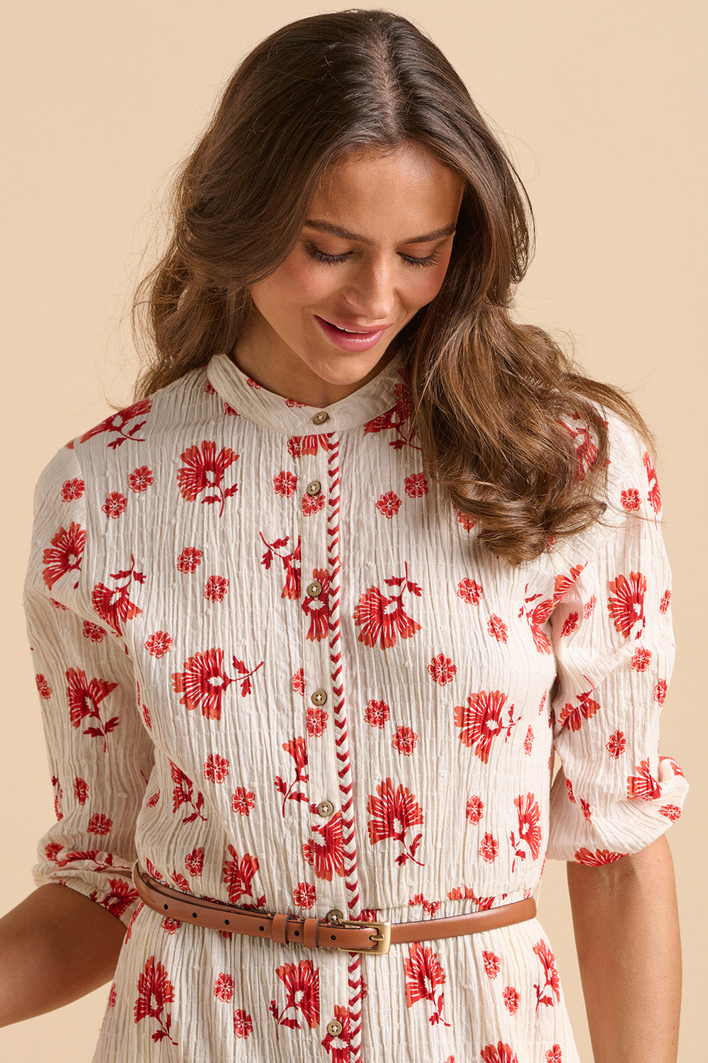 A model wearing the Fan Floral Cotton Knee Length Dress in colour Whitered, from the front, cropped image