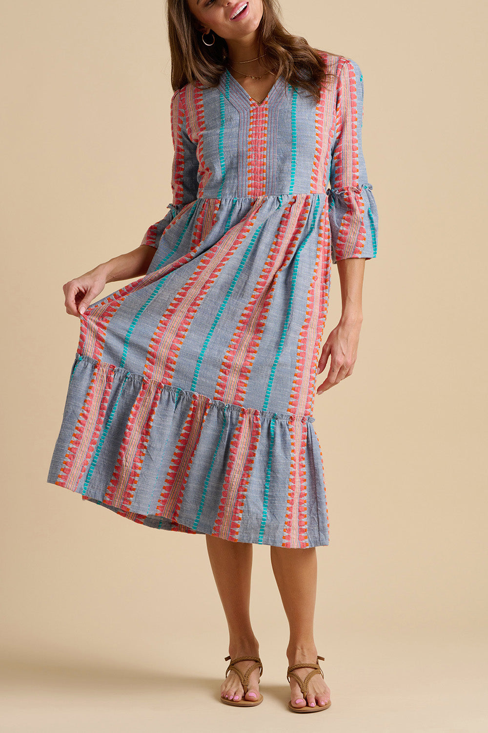 A model wearing the Shore Cotton Midi Dress in colour Bluered, from the front, cropped image
