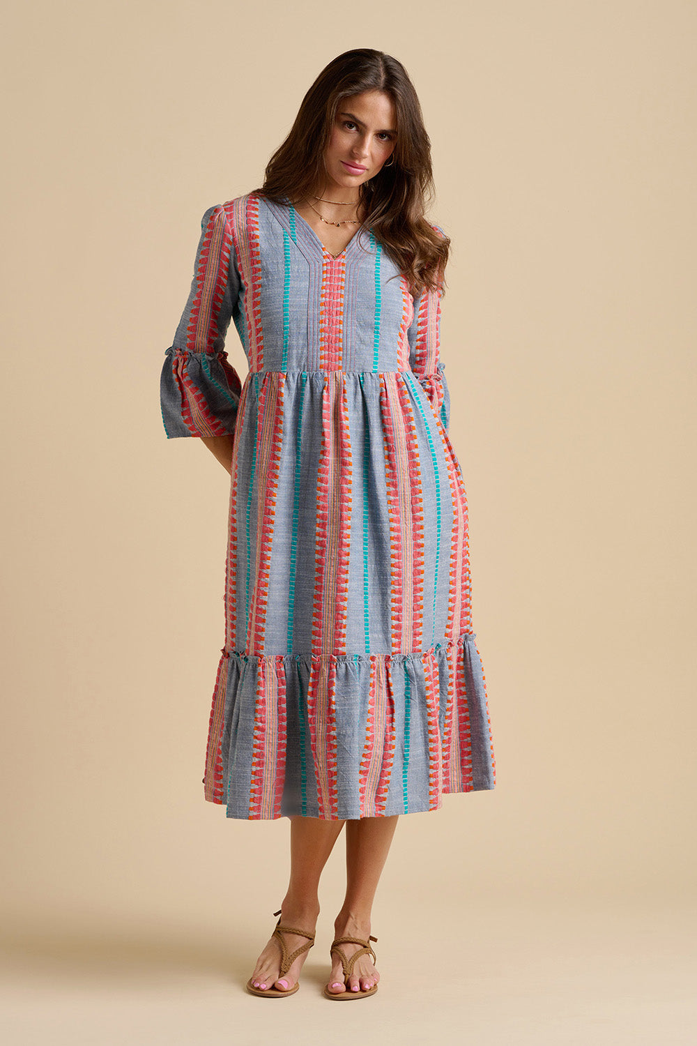 A model wearing the Shore Cotton Midi Dress in colour Bluered, from the front, showing the whole outfit