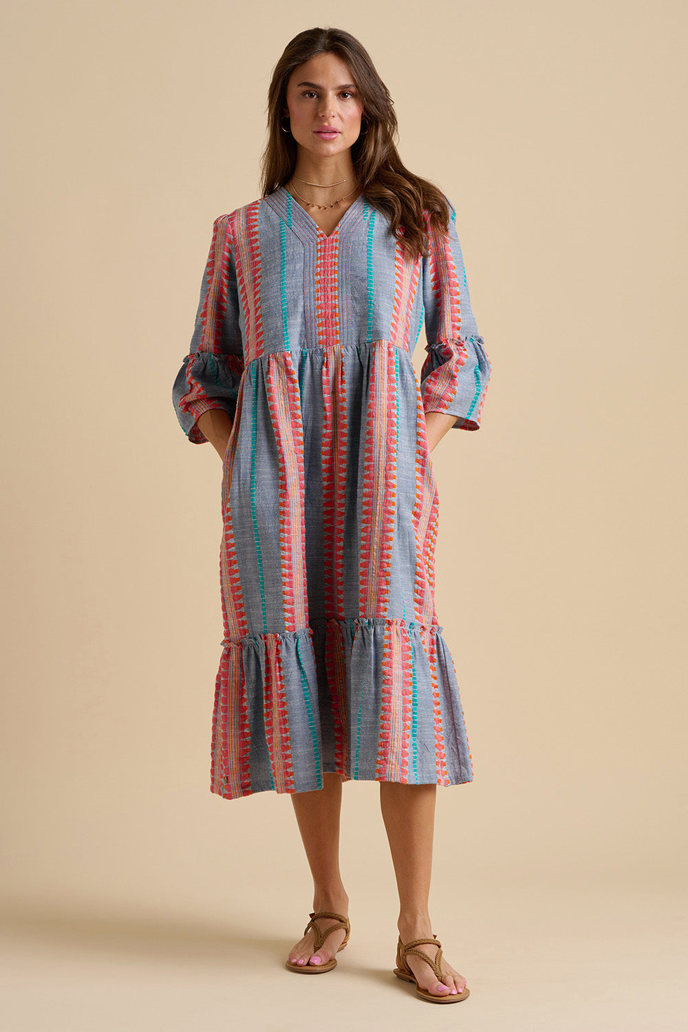 A model wearing the Shore Cotton Midi Dress in colour Bluered, from the front, showing the whole outfit