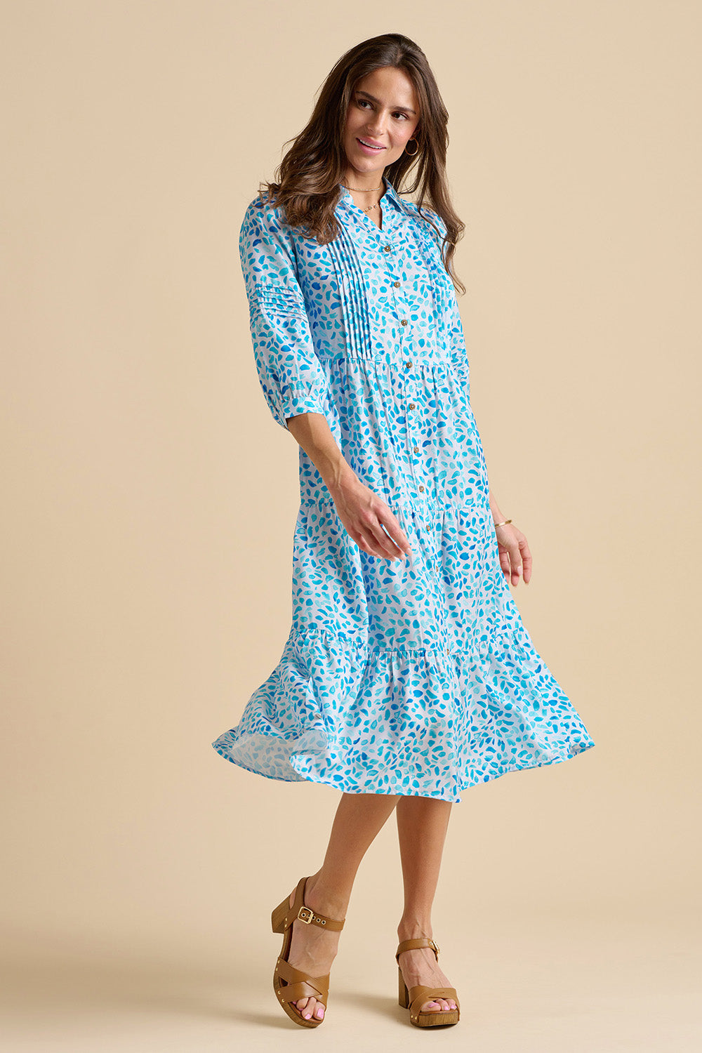 A model wearing the Sea Glitter Midi Dress in colour Blue (Blue), from the front, showing the whole outfit