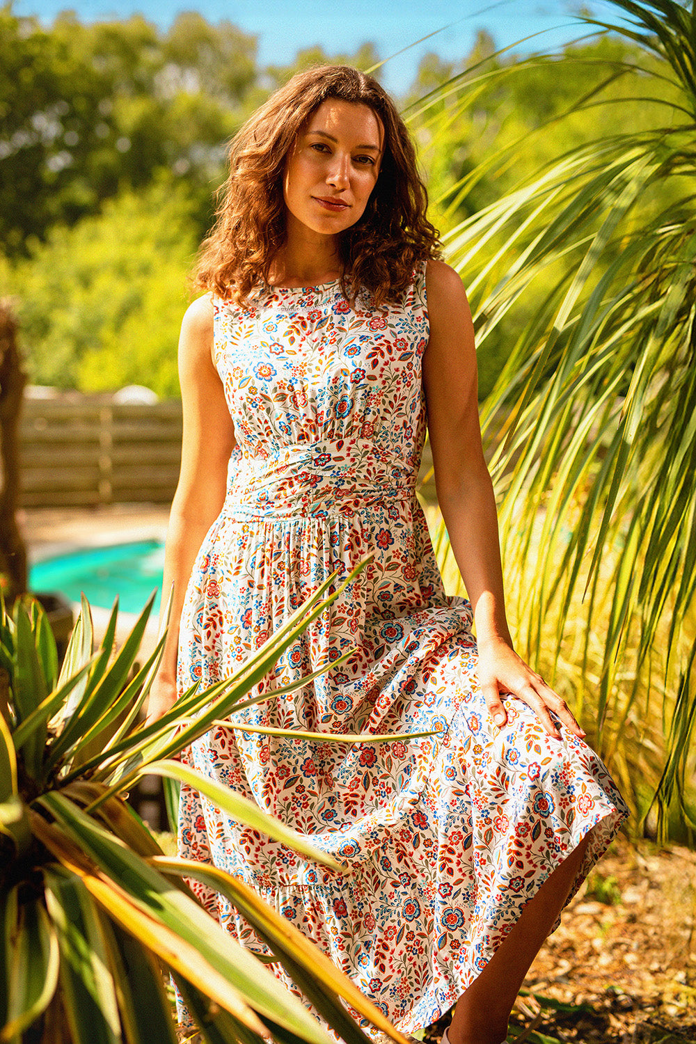 A model wearing the Cream Secret Garden Midi Dress in colour Multi, from the front, showing the whole outfit