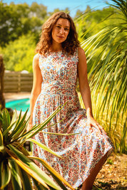 A model wearing the Cream Secret Garden Midi Dress in colour Multi, from the front, showing the whole outfit