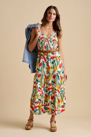 A model wearing the Falling Leaves Maxi Dress in colour Multi, from the front, showing the whole outfit