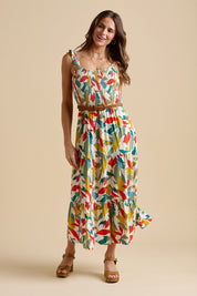 A model wearing the Falling Leaves Maxi Dress in colour Multi, from the front, showing the whole outfit