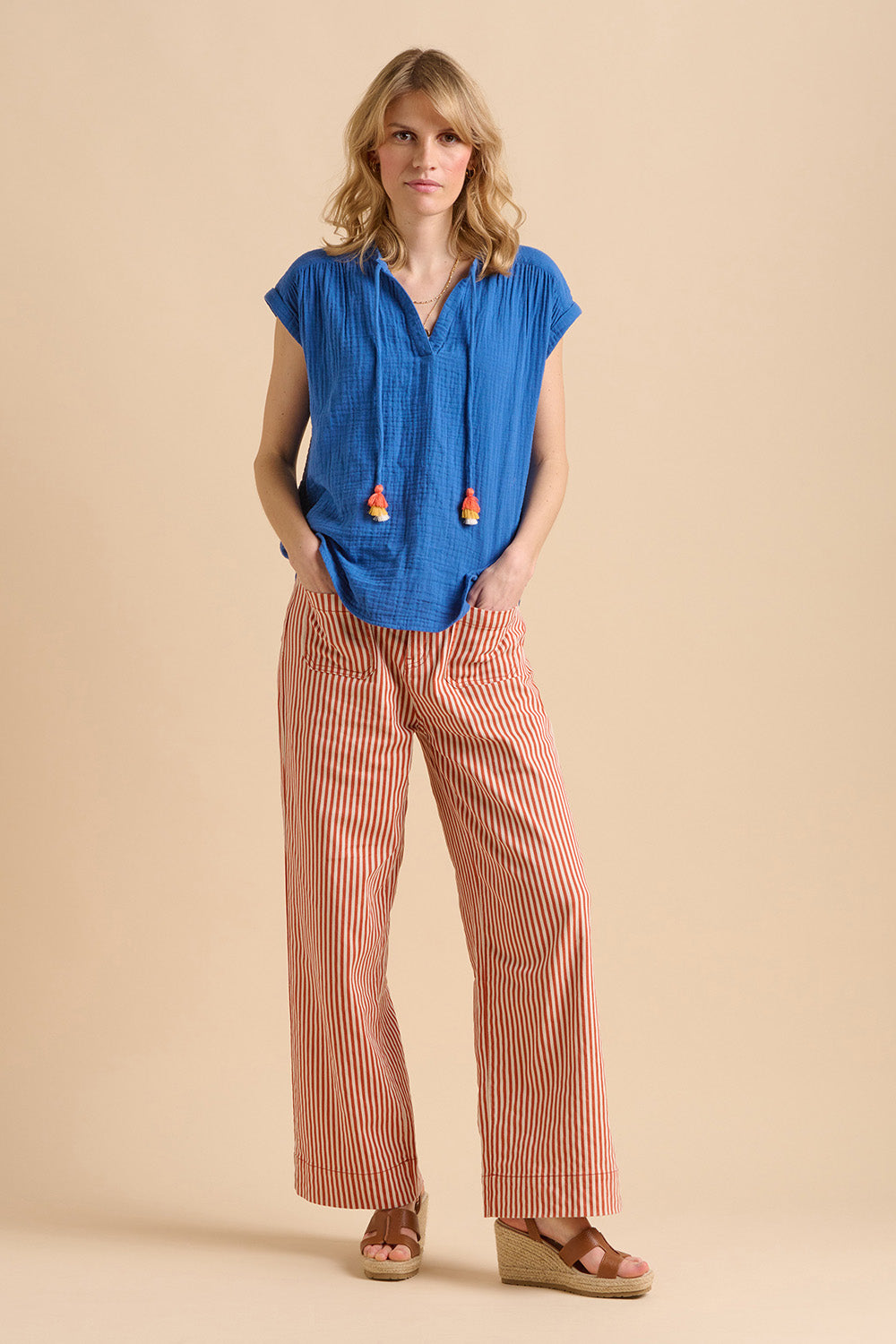 A model wearing the Ocean Cotton Blouse in colour Blue (Blue), from the front, showing the whole outfit
