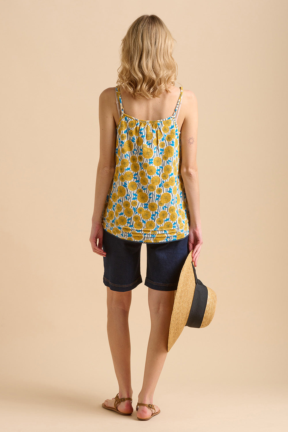 A model wearing the Parasol Cotton Cami in colour Multi, from the back
