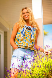 A model wearing the Parasol Cotton Cami in colour Multi, from the front, cropped image