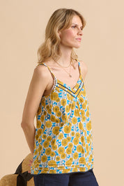 A model wearing the Parasol Cotton Cami in colour Multi, from the front, cropped image