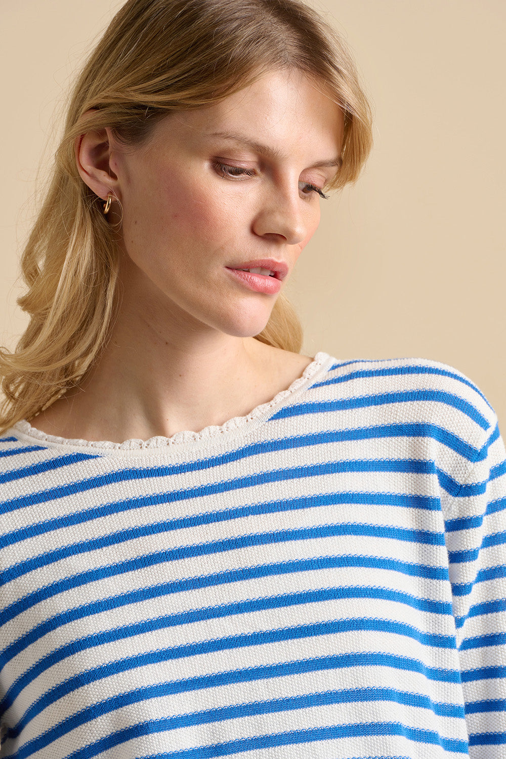 A model wearing the Scallop Neck Knitted Cotton Jumper in colour Blue (Blue), from the front, cropped image