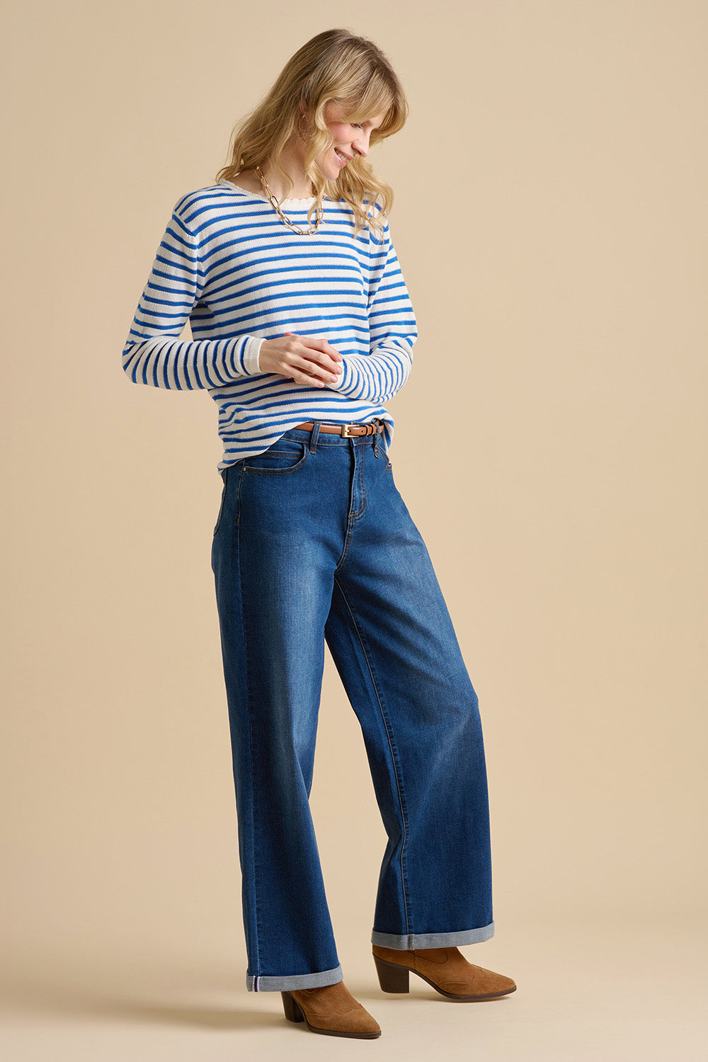 A model wearing the Scallop Neck Knitted Cotton Jumper in colour Blue (Blue), from the front, showing the whole outfit
