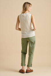 A model wearing the Pointelle Knitted Cotton Button Tank in colour Ceam, from the back