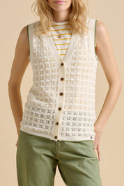 A model wearing the Pointelle Knitted Cotton Button Tank in colour Ceam, from the front, showing the whole outfit